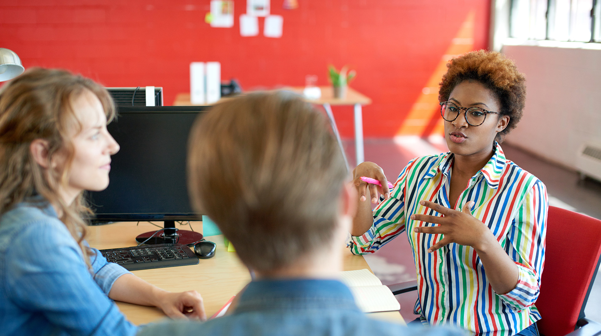 diverse group of students interacting in a workshop setting