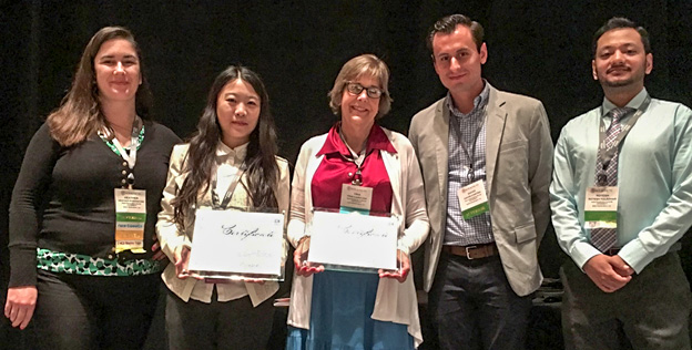 Christine Caratan, center, and recipients